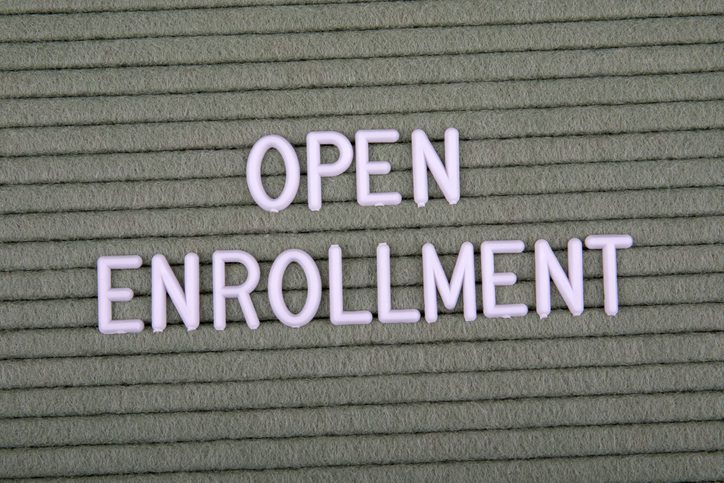 OPEN ENROLLMENT. White letters of the alphabet on a green background. Text and information