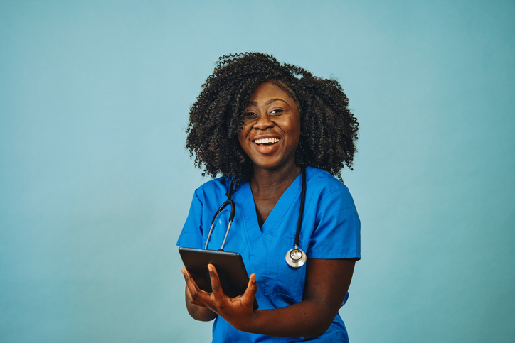 Nurse with stethoscope smiling